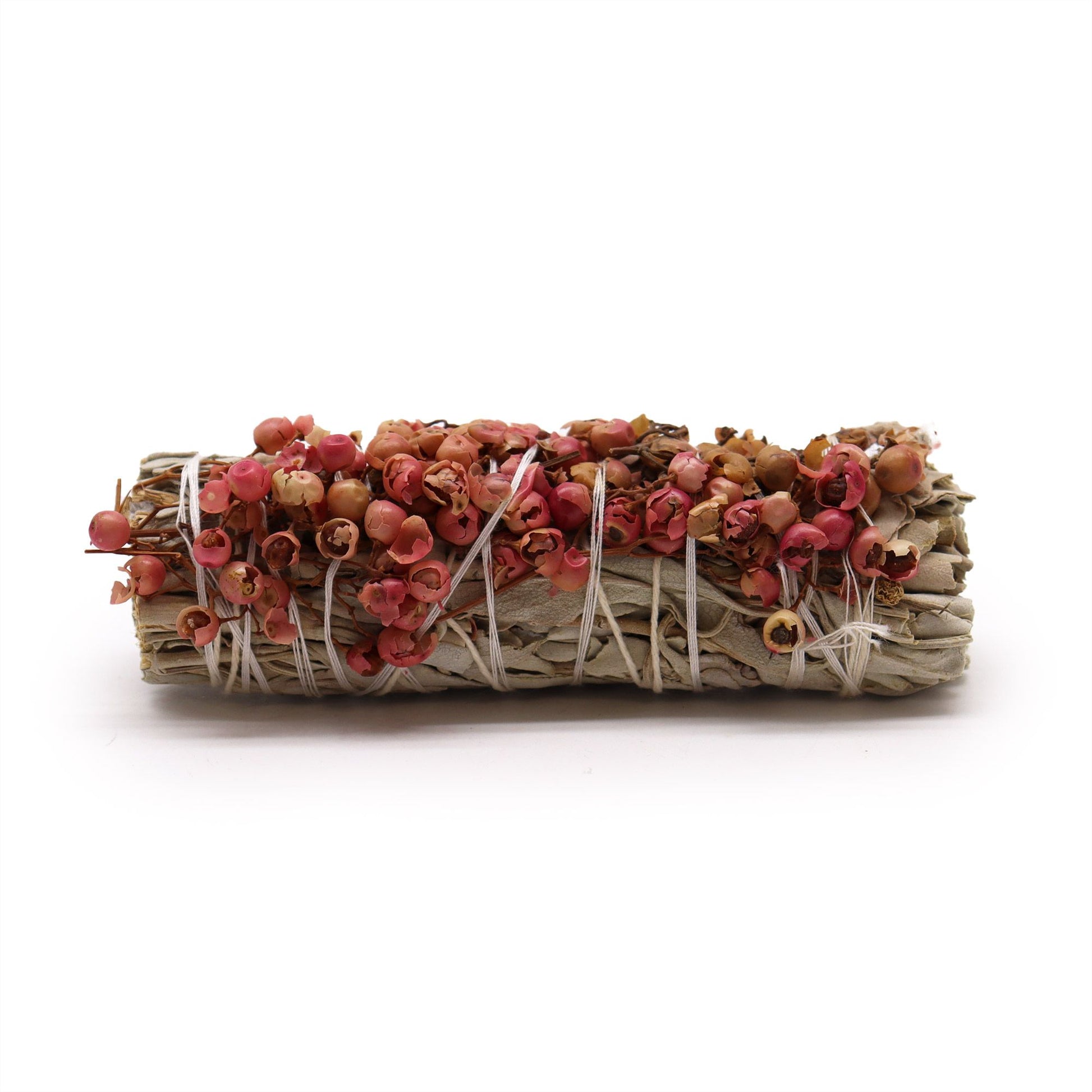 Bundled sage with pink and orange leaves on a white background